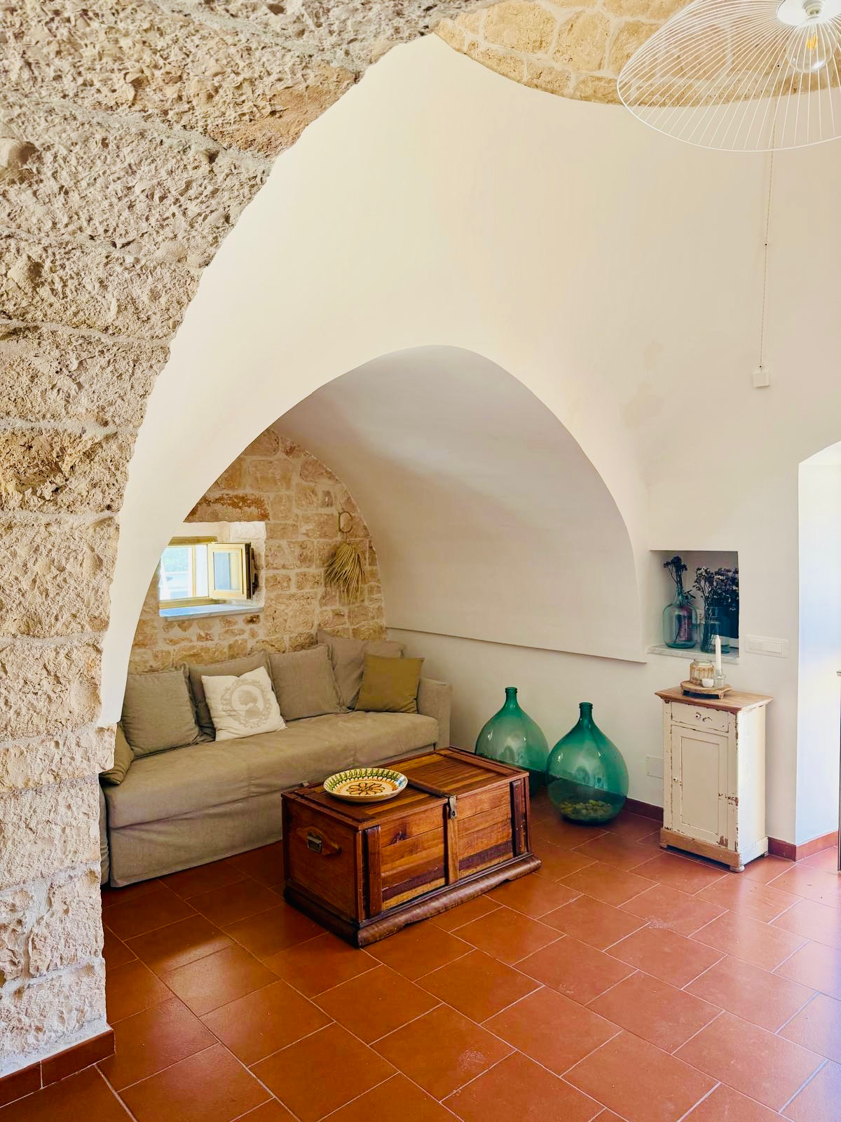 Quiet sitting corner framed by ancient stone arches
