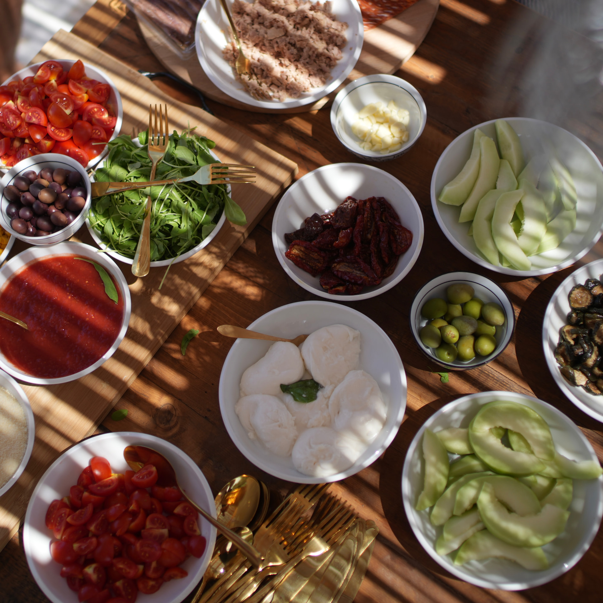 A sunlit table filled with fresh Puglian ingredients