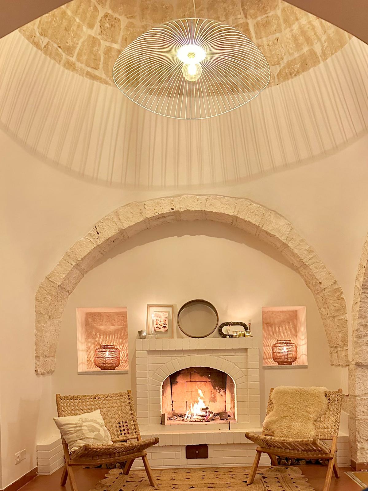 Original stone fireplace inside the trullo