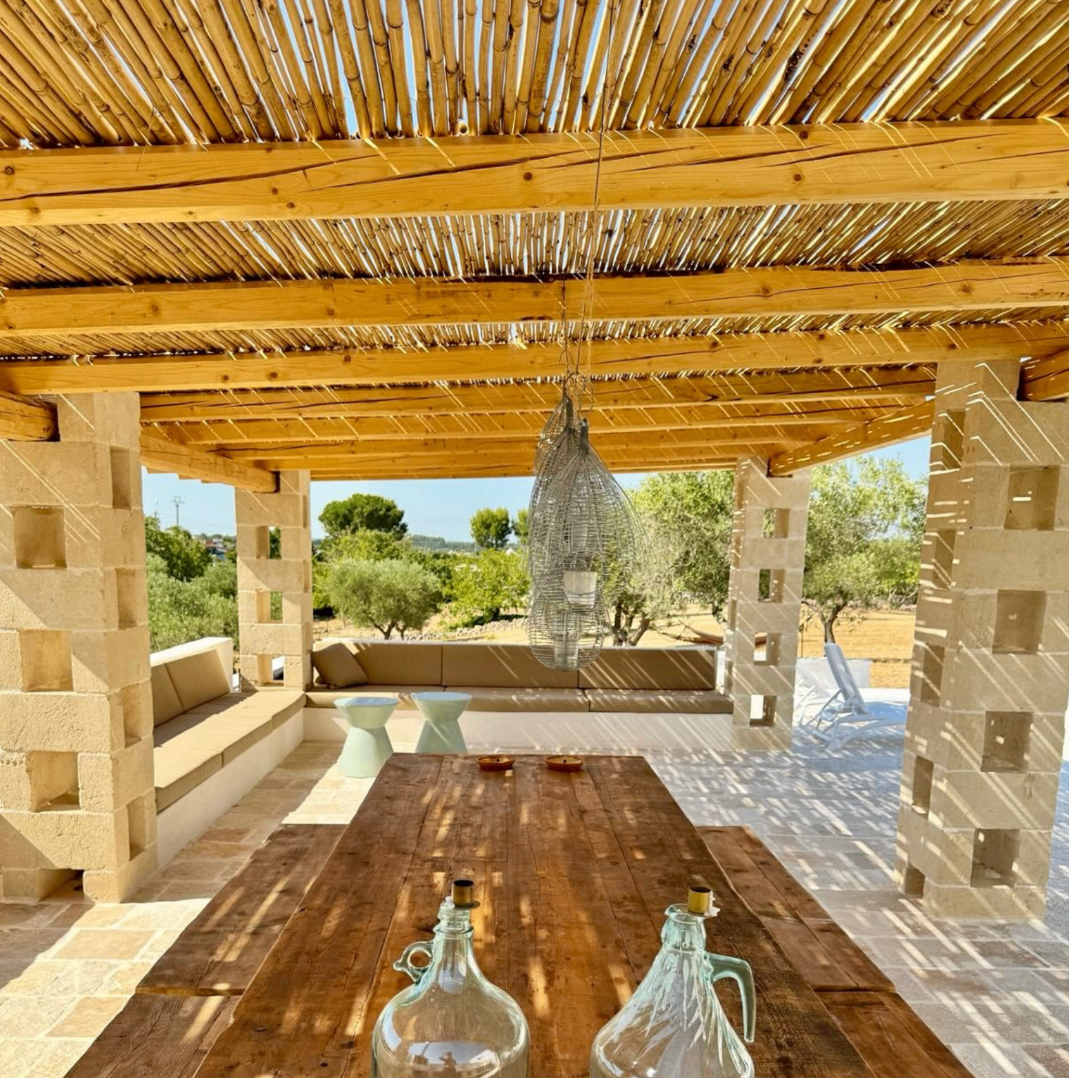Shaded terrace under the pergola at a Puglian trullo retreat